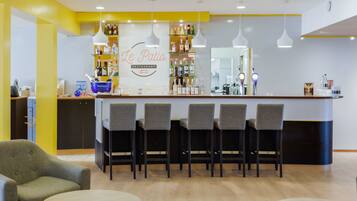A restaurant interior with a bar area, seating, and a visible menu board.