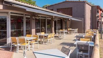 Lunch, dinner served; international cuisine, pool views