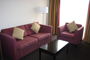 Suite, 1 King Bed, Non Smoking, Fireplace | Living area | 37-inch LED TV with cable channels, TV