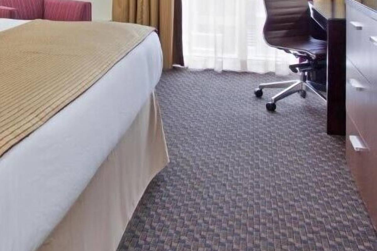 Premium bedding, desk, blackout drapes, soundproofing
