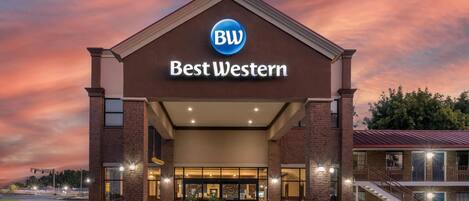 A Best Western hotel with a prominent sign, brick facade, and a covered entrance area.