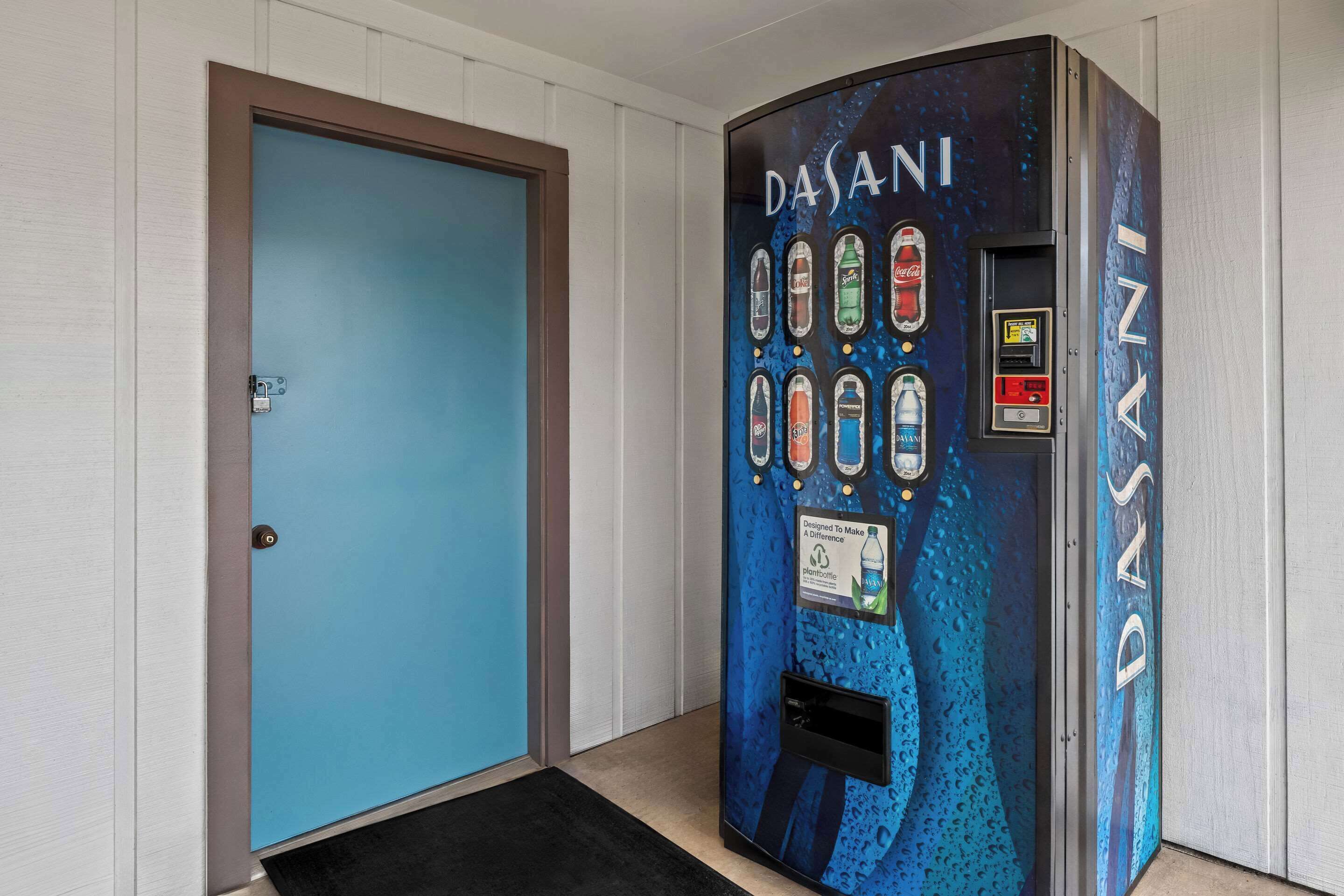 A vending machine with a blue door and a logo that reads "DASANI".