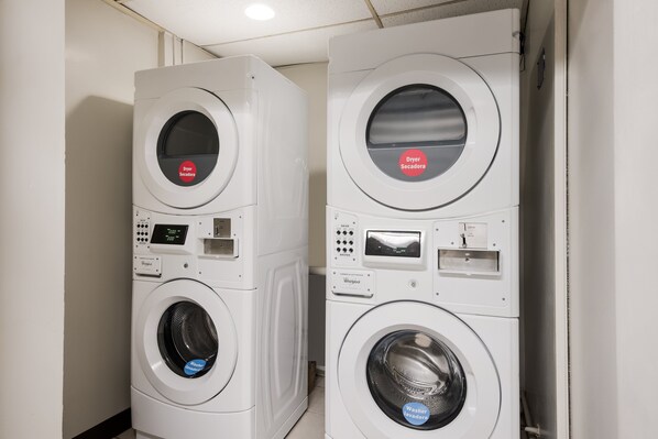 Two stacked washing machines in a laundry room. - Red Roof Inn Lenoir (Lenoir)