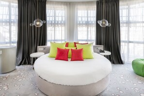 Premium bedding, down comforters, minibar, in-room safe