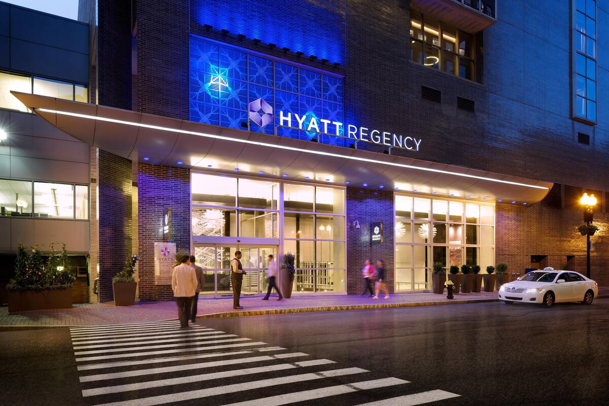 The exterior of a hotel with a prominent sign reading "HYATT REGENCY".