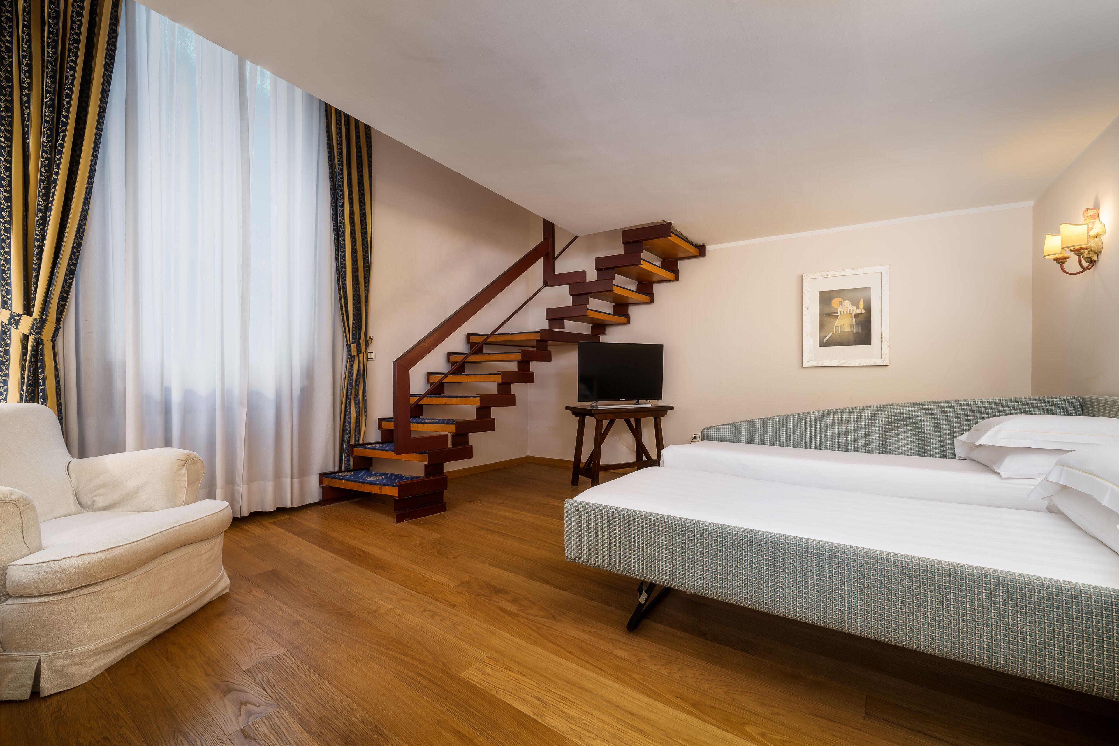 family room | minibar, in-room safe, desk, iron/ironing board