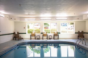 Indoor pool, open 8:00 AM to midnight, pool loungers