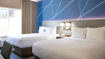 Desk, laptop workspace, iron/ironing board, free cribs/infant beds