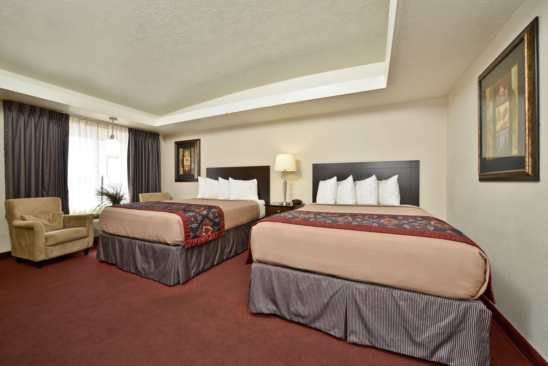 Pillowtop beds, desk, blackout drapes, iron/ironing board