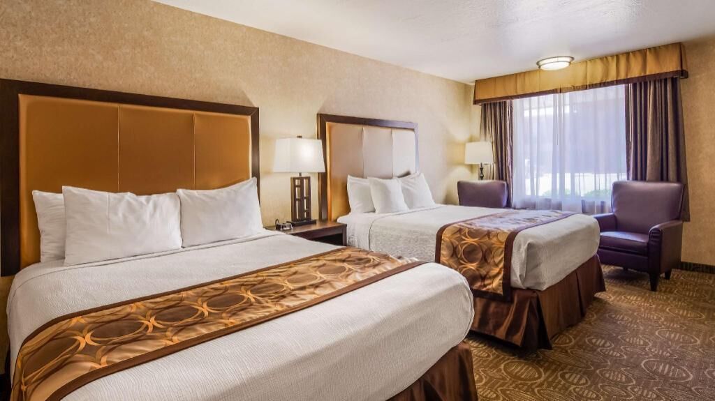 Pillowtop beds, desk, blackout drapes, iron/ironing board
