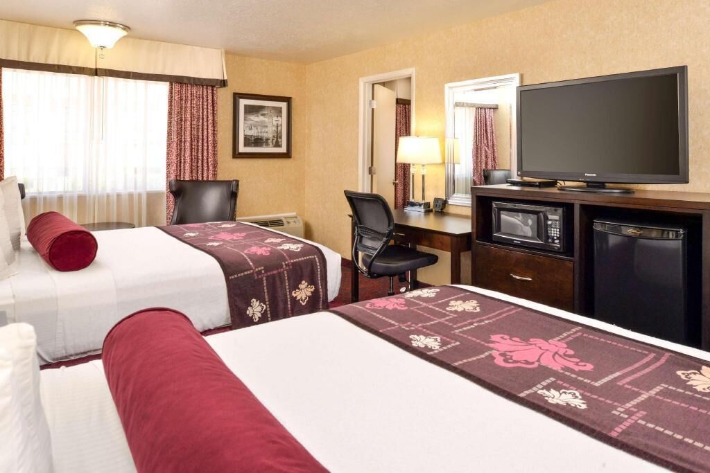 Pillowtop beds, desk, blackout drapes, iron/ironing board