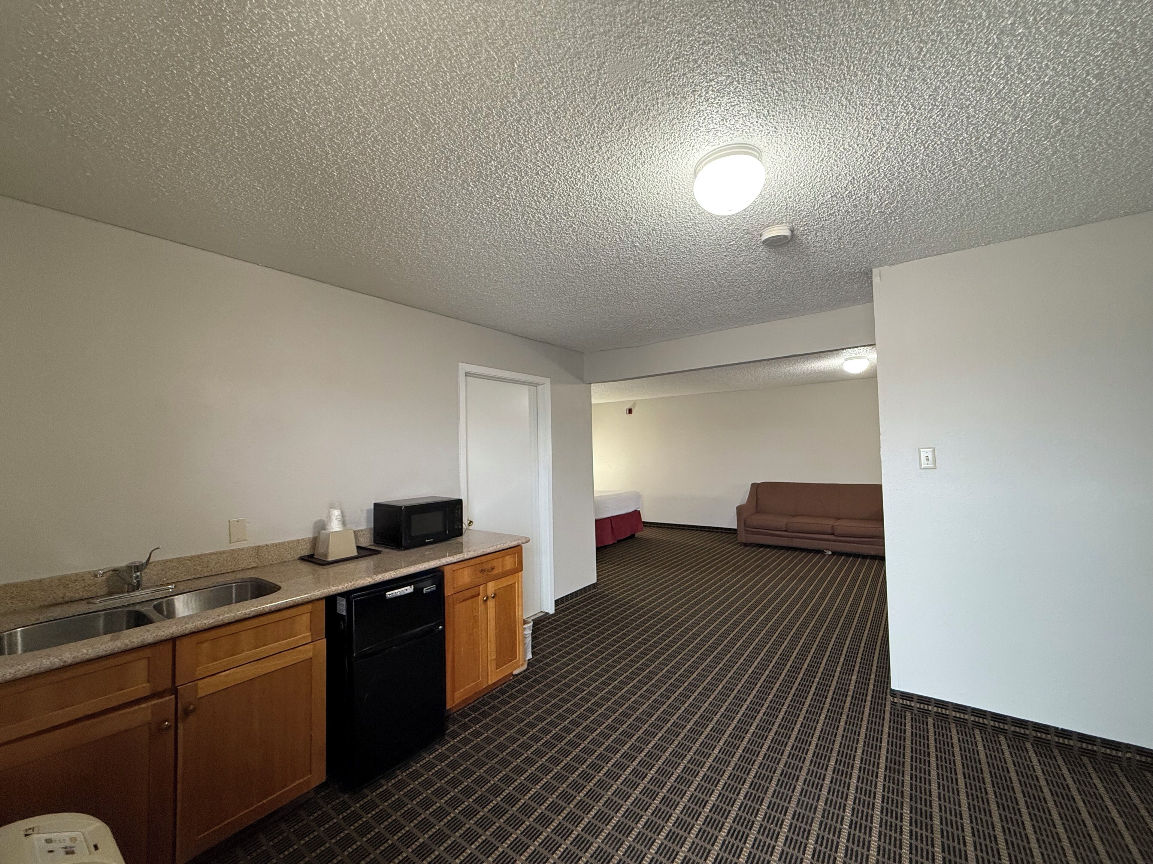 Studio Suite, 1 King Bed, Non Smoking | Desk, blackout curtains, iron/ironing board, free cots/infant beds