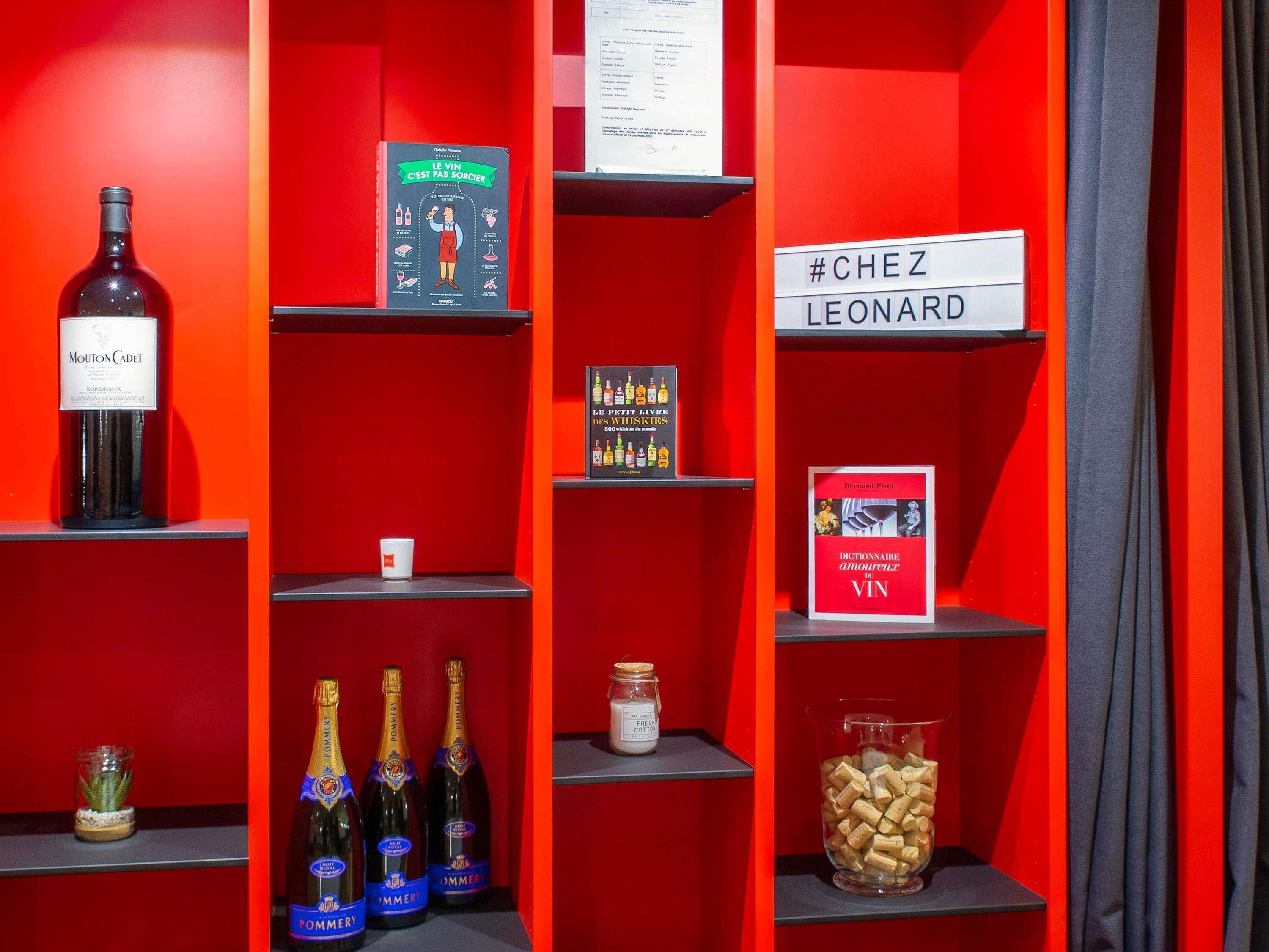 A wine display with bottles and books.