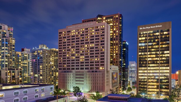 A high-rise hotel with multiple floors, a prominent sign at the top, and a well-lit facade. - Marriott Vacation Club®, San Diego (San Diego)