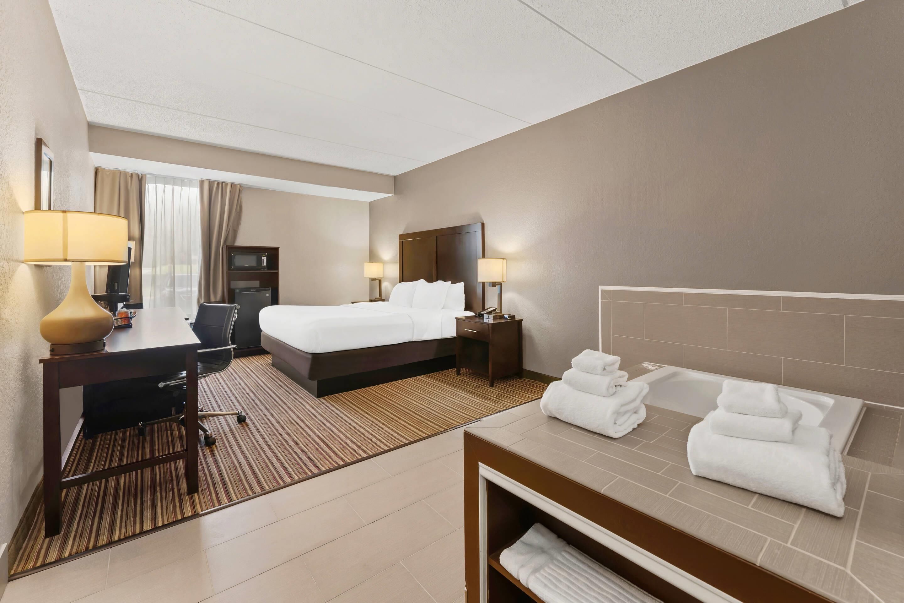 Room, 1 King Bed, Non Smoking, Jetted Tub | Desk, iron/ironing board, free WiFi, bed sheets