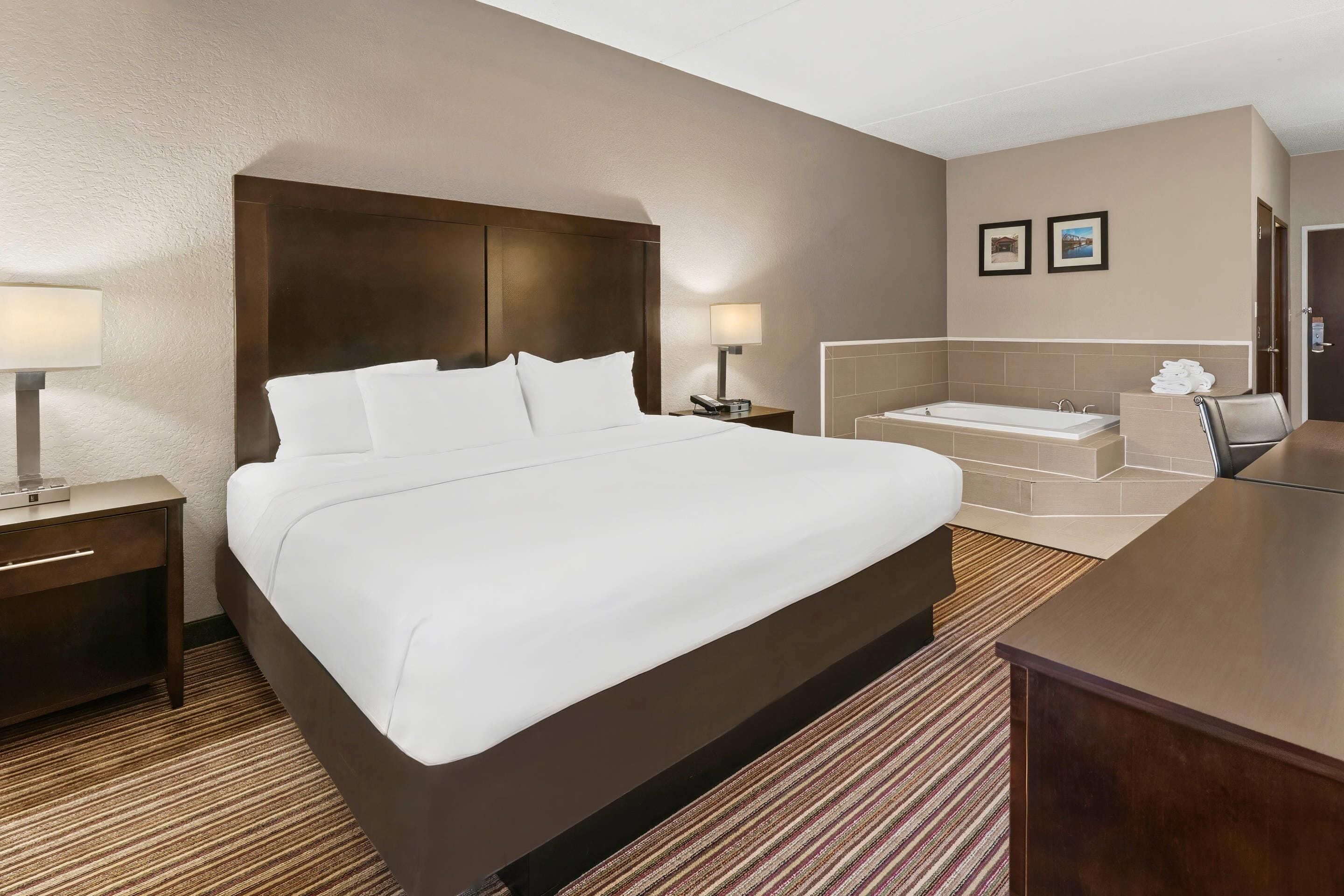 Room, 1 King Bed, Non Smoking, Jetted Tub | Desk, iron/ironing board, free WiFi, bed sheets