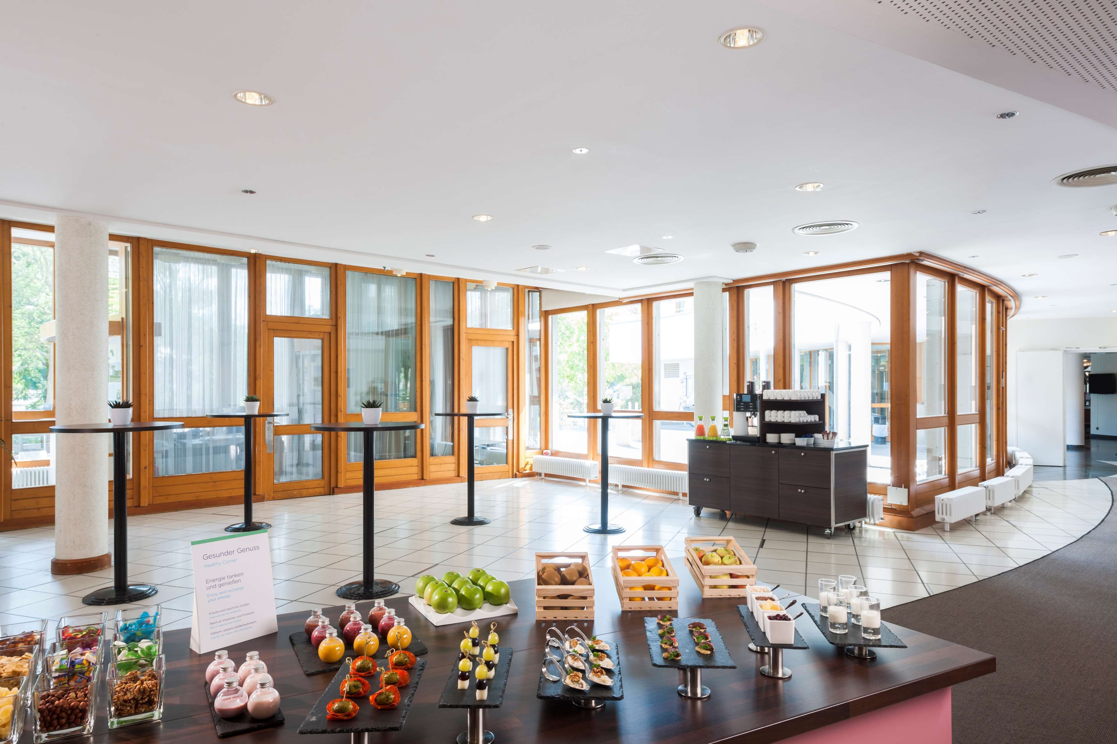 A buffet area with various food items and a sign indicating a health-conscious option.