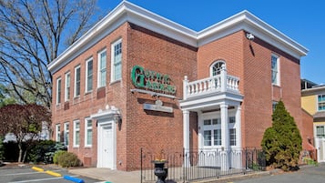 A brick building with a sign reading "Gothic Gardens Hotel Northampton."