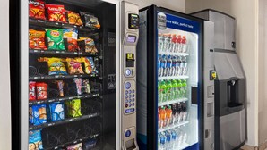 A vending machine with snacks and a water dispenser.