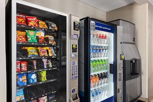 A vending machine with snacks and a water dispenser.