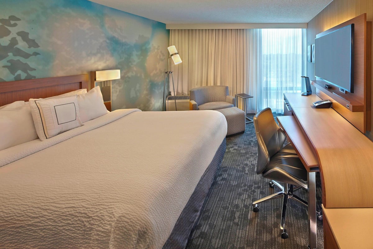 Hypo-allergenic bedding, desk, laptop workspace, blackout curtains