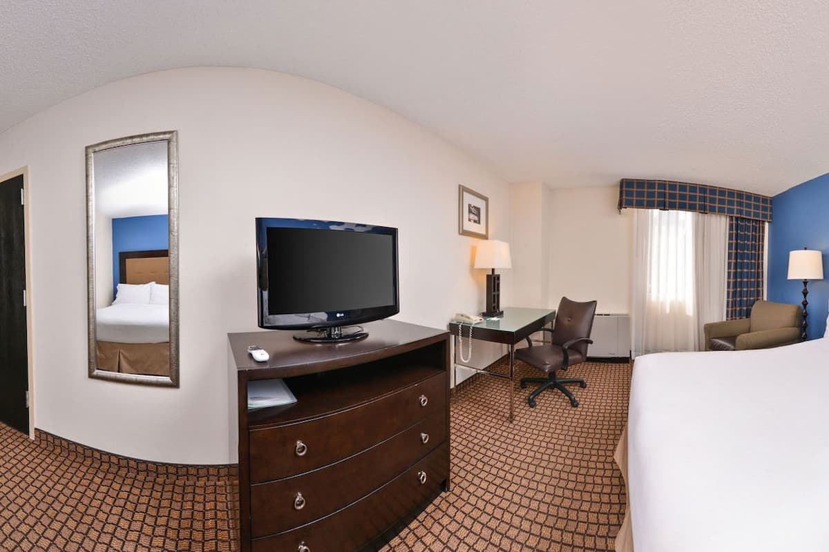 Desk, laptop workspace, blackout drapes, iron/ironing board