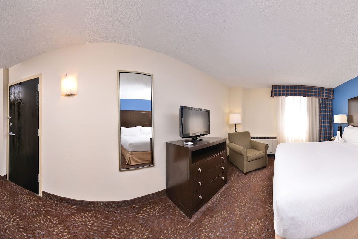 Desk, laptop workspace, blackout drapes, iron/ironing board