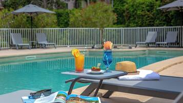 Seasonal outdoor pool, pool umbrellas, pool loungers