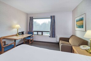 Premium bedding, blackout curtains, iron/ironing board