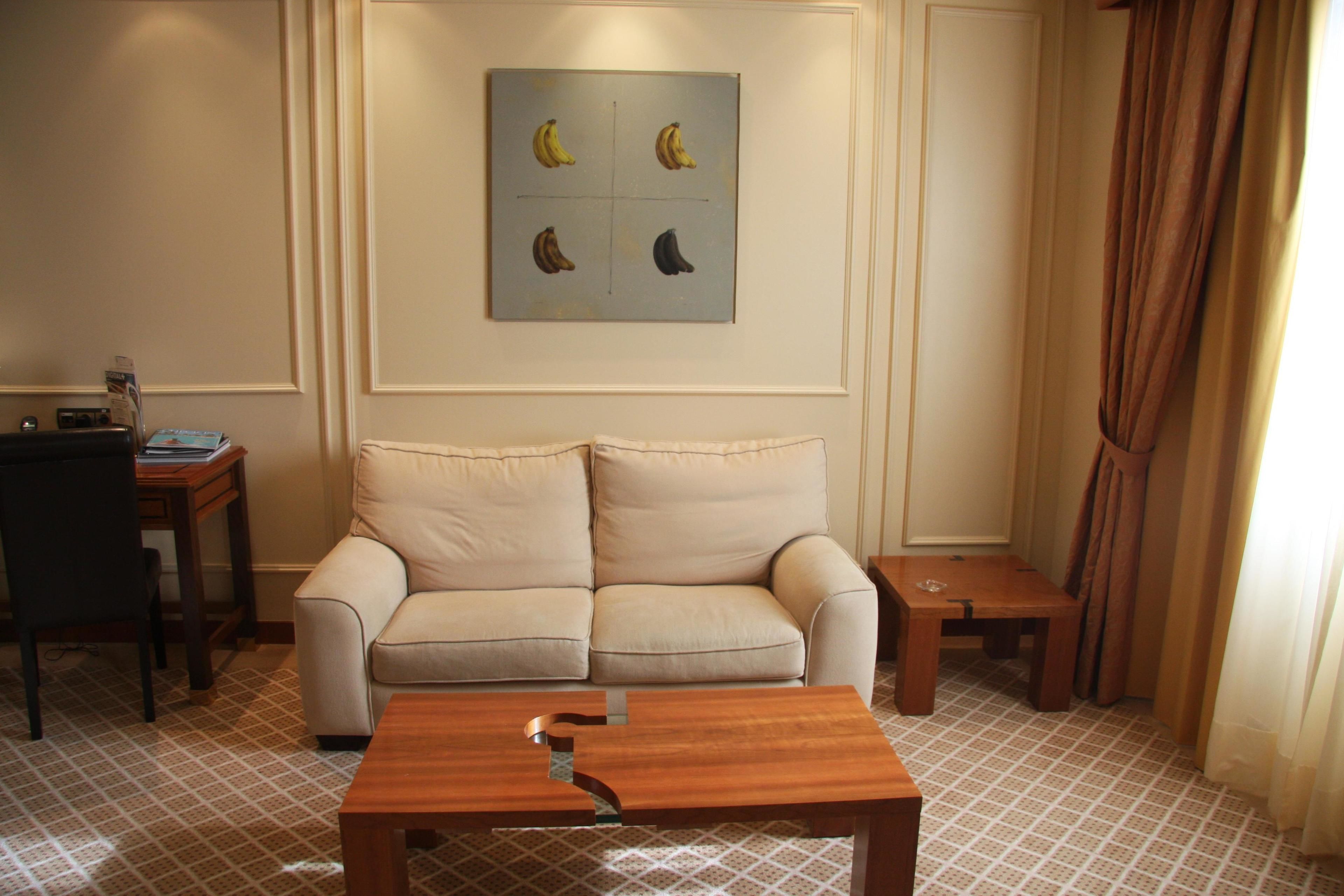 deluxe suite | living area | 32-inch lcd tv with digital channels, tv