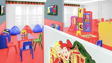Children can play and learn in this vibrant play area with a slide, climbing frames, and a variety of seating options.