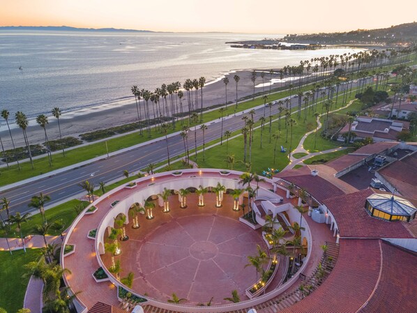 Surrounded by a tranquil courtyard with a central fountain, this hotel offers serene ocean views and a mix of traditional and modern architecture.