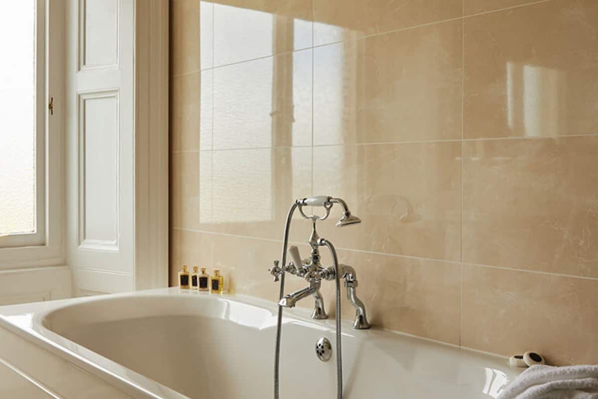 combined shower/bathtub, designer toiletries, hair dryer, bathrobes