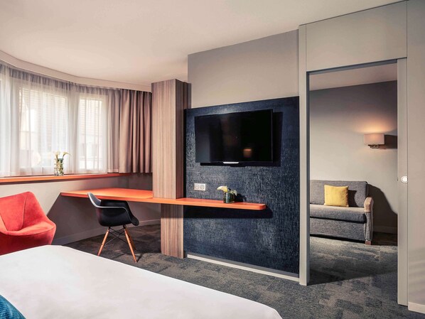 Luxe beddengoed, een minibar, een kluis op de kamer, een bureau