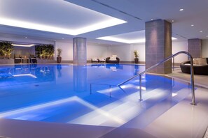 Indoor pool, open 9:00 AM to 10:00 PM, pool loungers