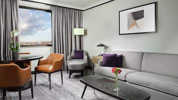 Executive Suite, 1 King Bed | Living area | 55-inch flat-screen TV with digital channels, toys