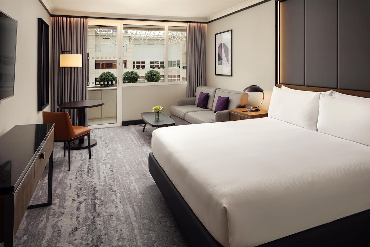 Family Room, 1 King Bed (Executive) | Living area | 55-inch flat-screen TV with digital channels, toys