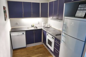 Premium bedding, desk, laptop workspace, blackout drapes