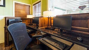 A home office with two computer desks, each with a monitor, keyboard, and chair. - Best Western Paradise Inn & Resort (Fillmore)