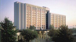 A multi-story hotel with a modern design, featuring a prominent sign at the top. - Millennium Hotel Maxwell House Nashville (Nashville)