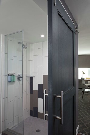 Shower, designer toiletries, hair dryer, towels
