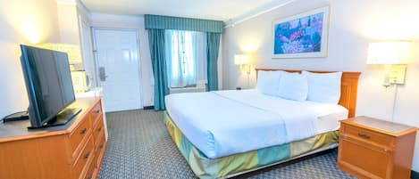 Premium bedding, desk, laptop workspace, blackout drapes