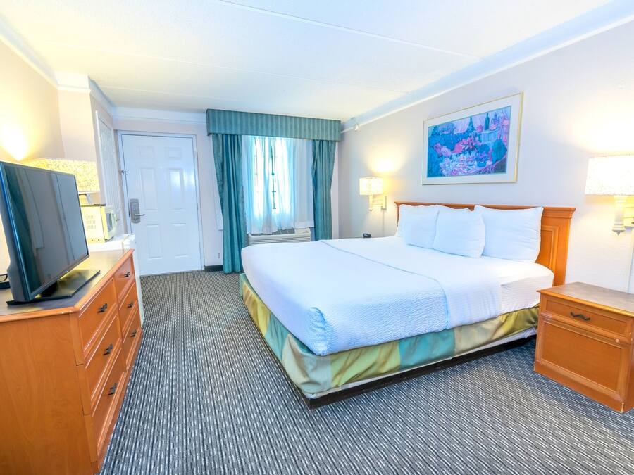 Premium bedding, desk, laptop workspace, blackout curtains