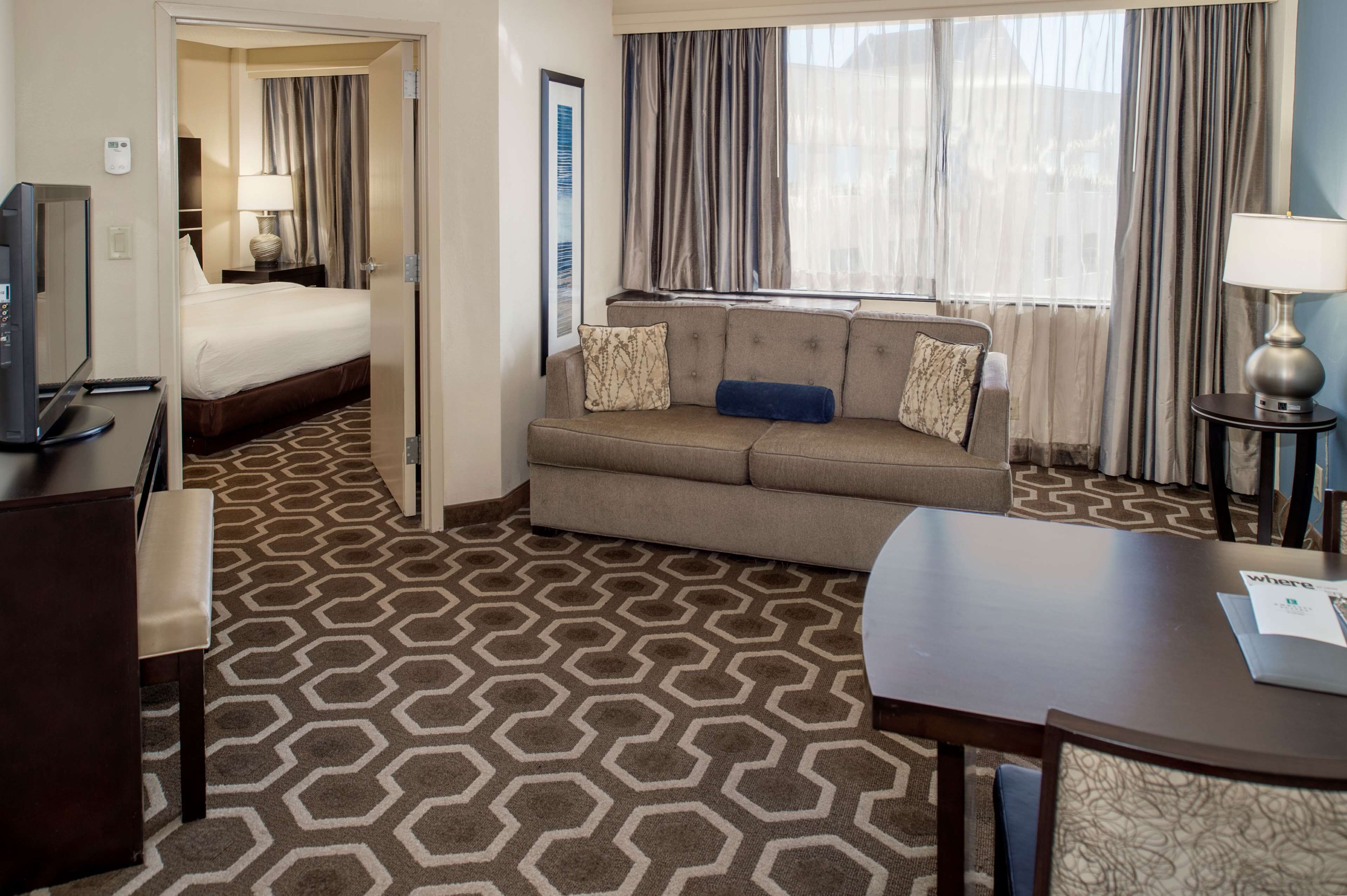 suite, 1 king bed | living area | 42-inch flat-screen tv with cable channels, tv, mp3 dock