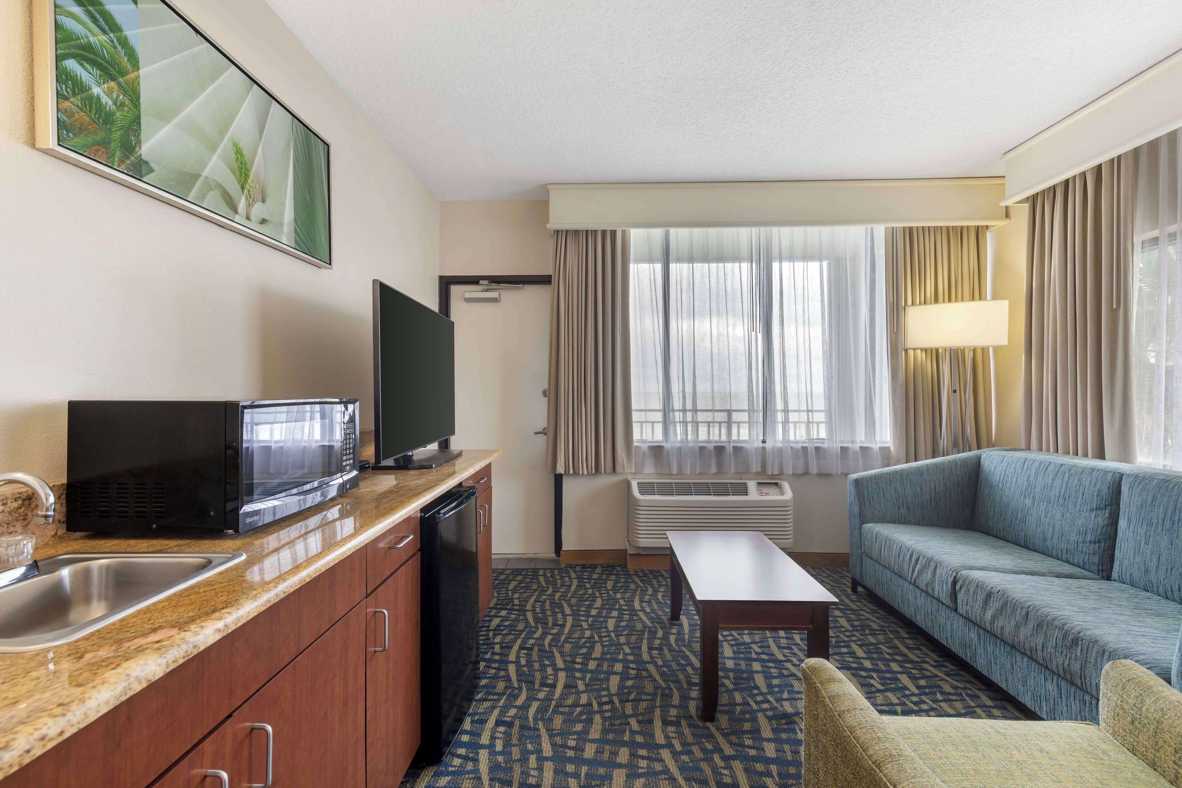 pillow-top beds, desk, laptop workspace, blackout curtains