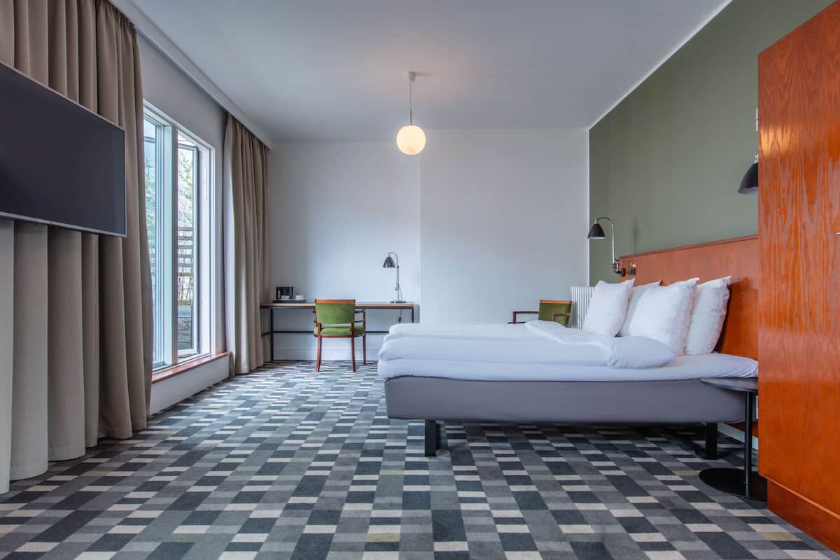 Hypo-allergenic bedding, pillow-top beds, desk, laptop workspace