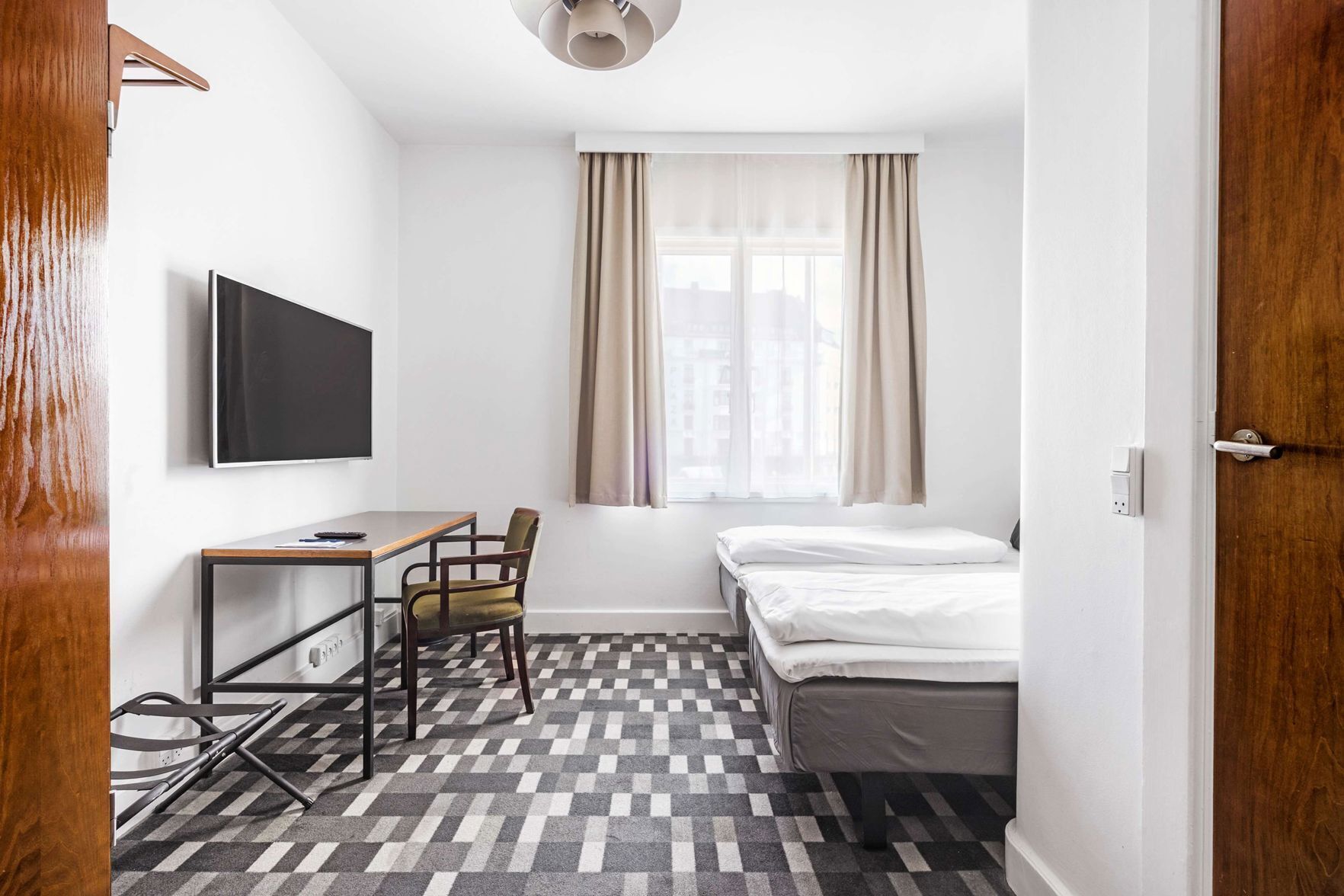 Hypo-allergenic bedding, pillow-top beds, desk, laptop workspace