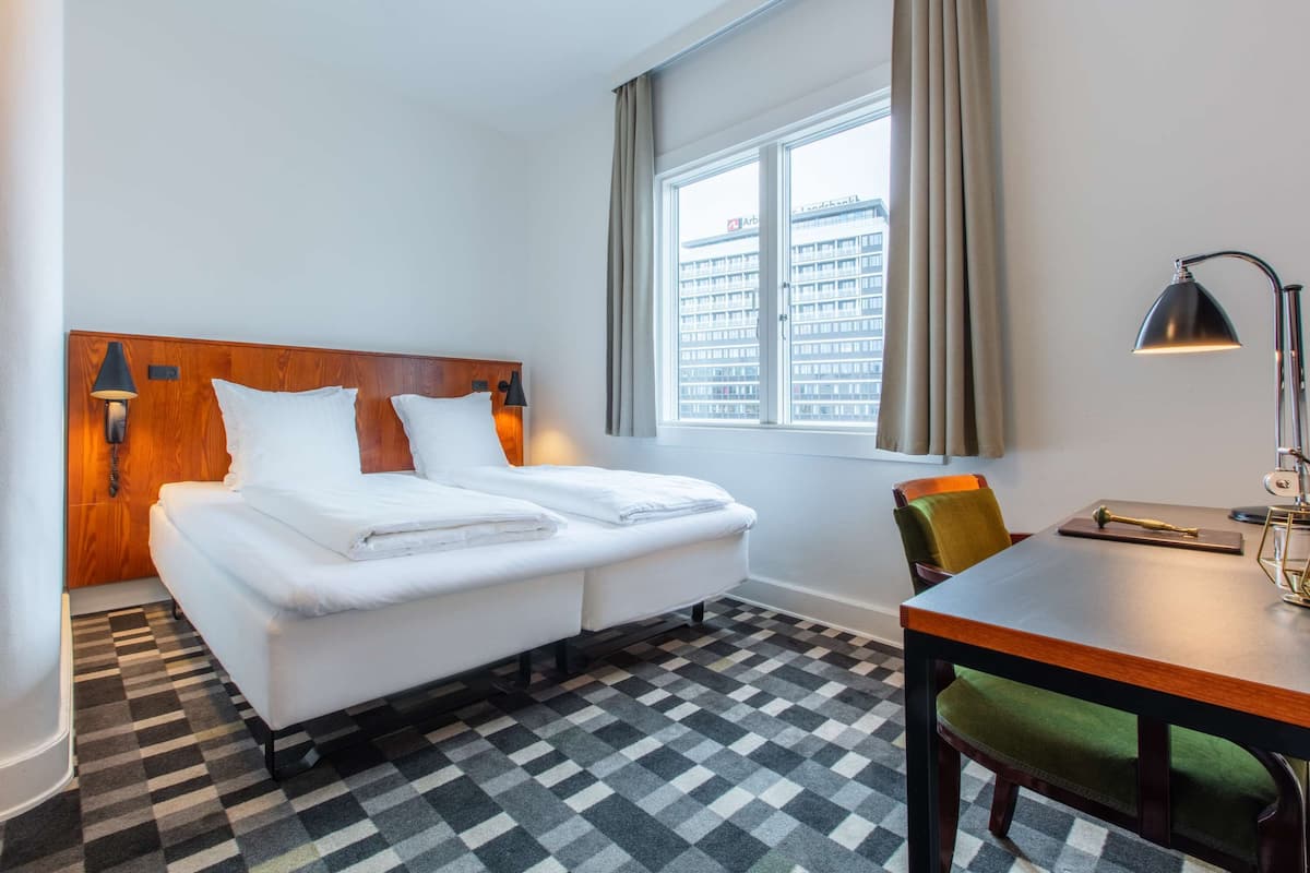 Hypo-allergenic bedding, pillow-top beds, desk, laptop workspace
