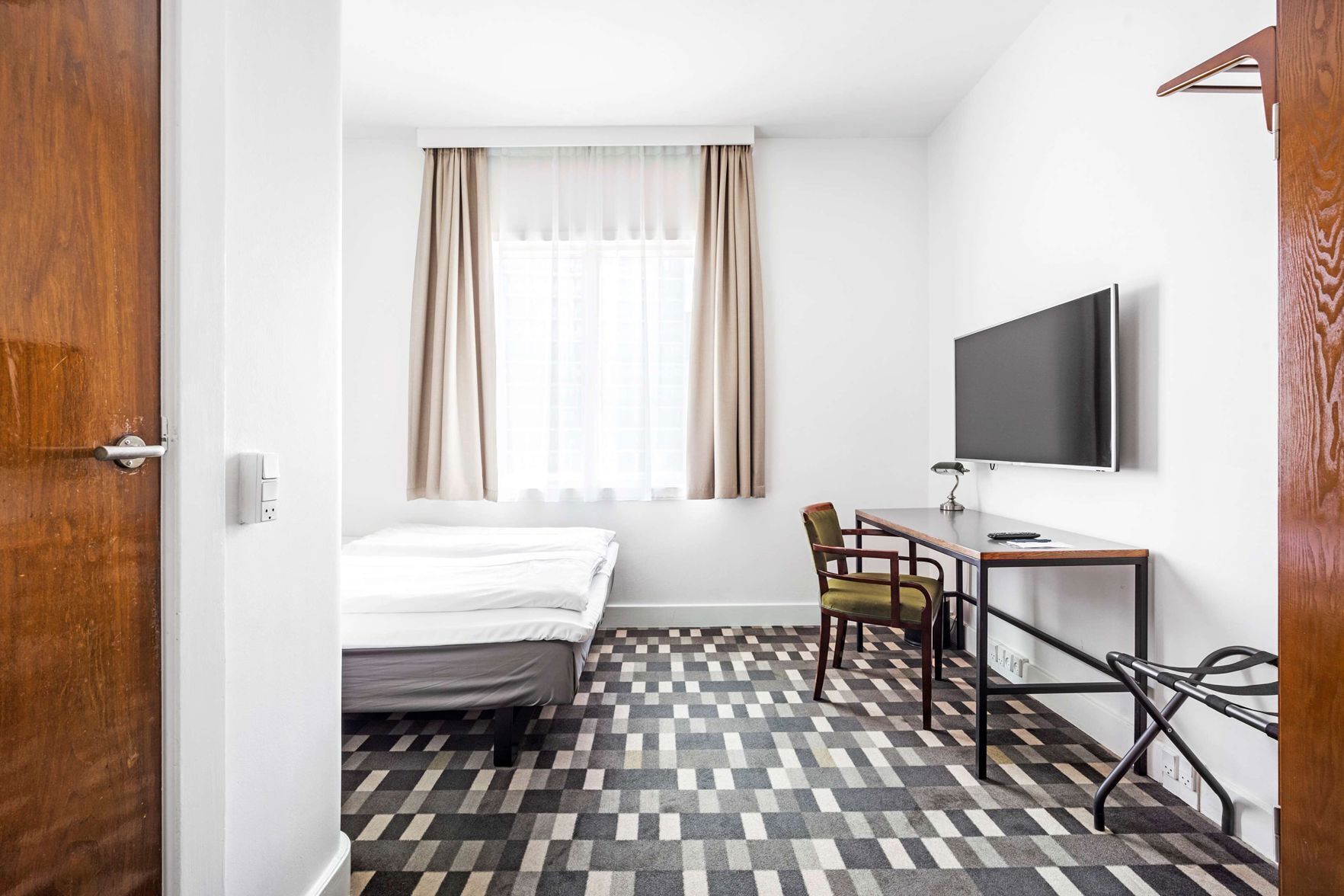Hypo-allergenic bedding, pillow-top beds, desk, laptop workspace
