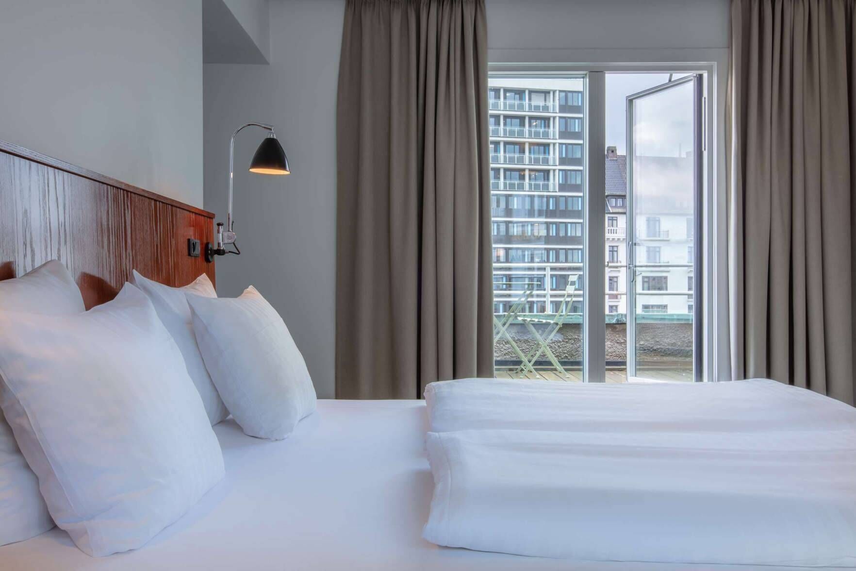 Hypo-allergenic bedding, pillow-top beds, desk, laptop workspace